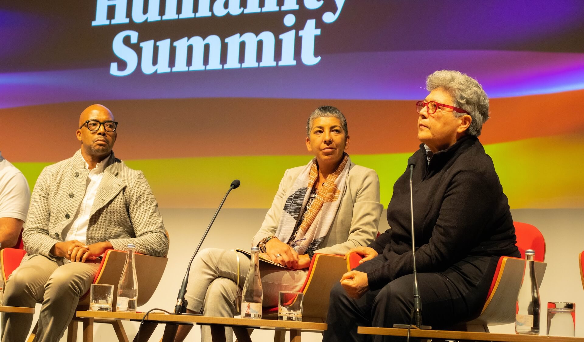 Humanity Summit 2023 stage photograph illustrating the video archive